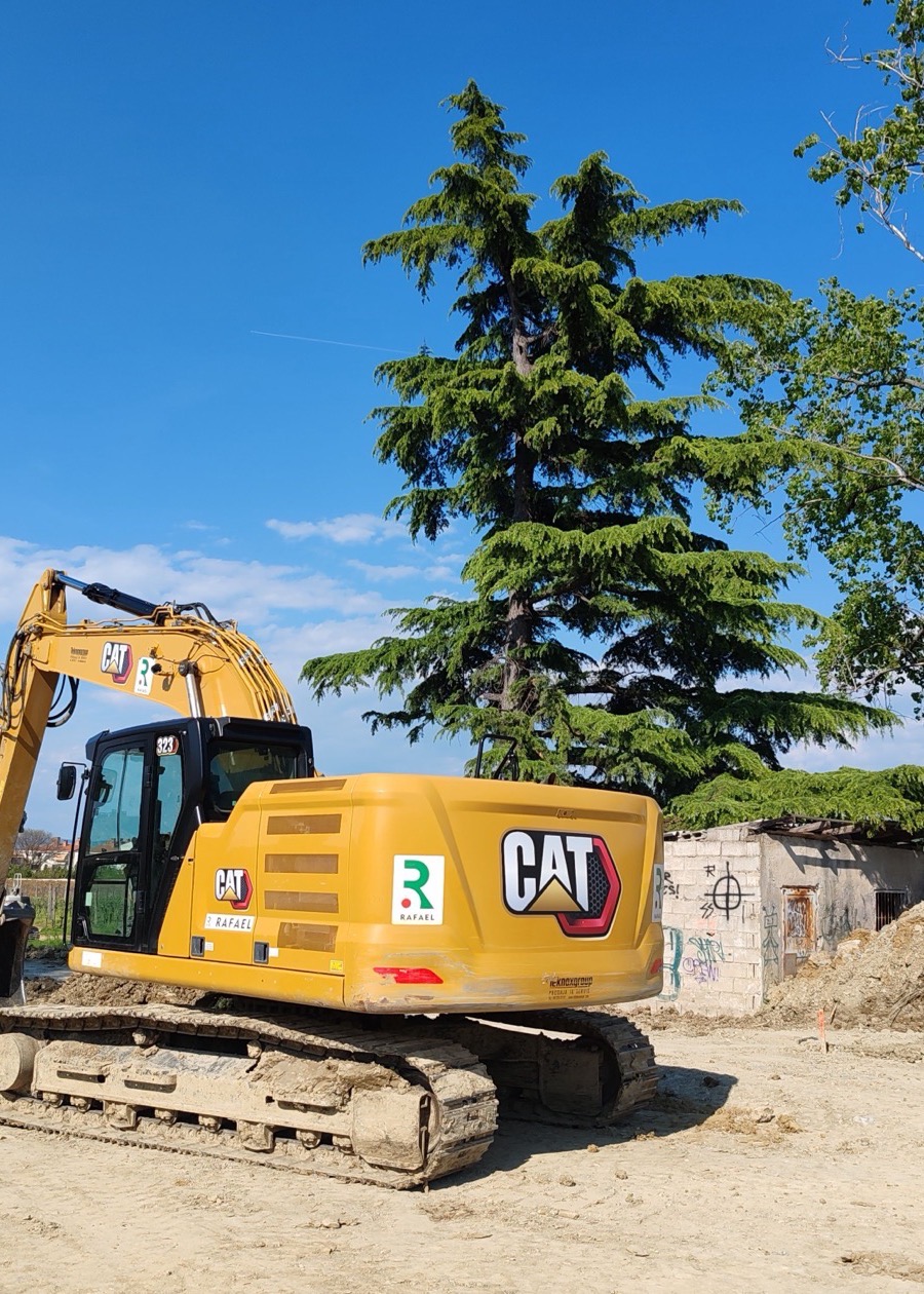 Excavator operating at an active construction site for machine-control applications