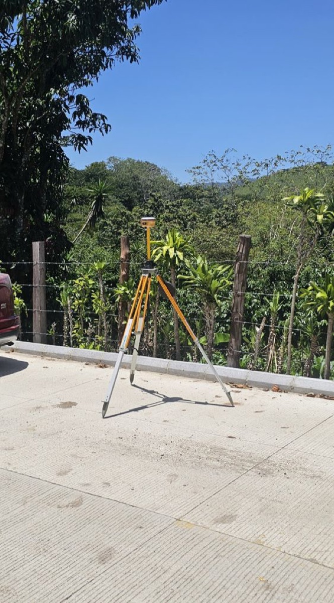 Spherefix GNSS receiver set up on a tripod for an outdoor field survey in Guatemala