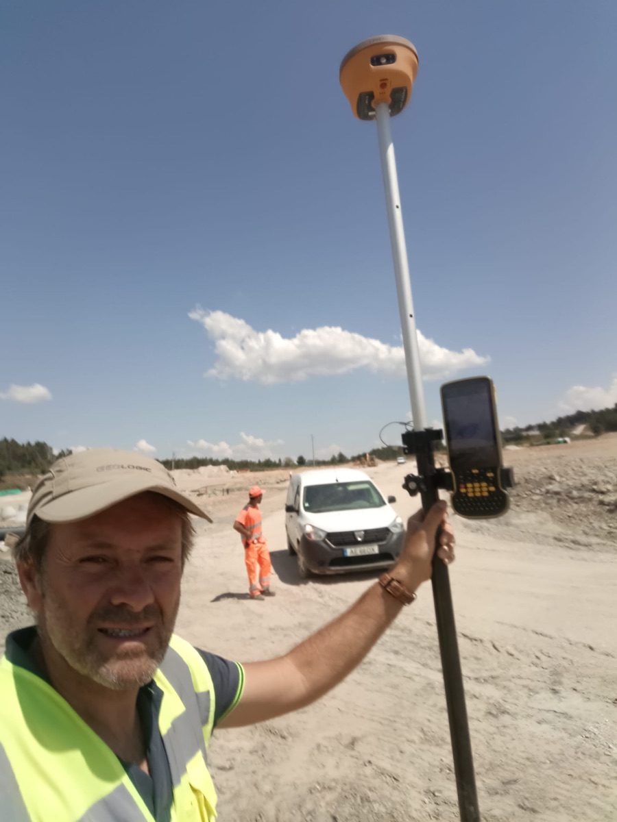 Spherefix GNSS receiver and controller used by a surveyor on a construction project in Portugal
